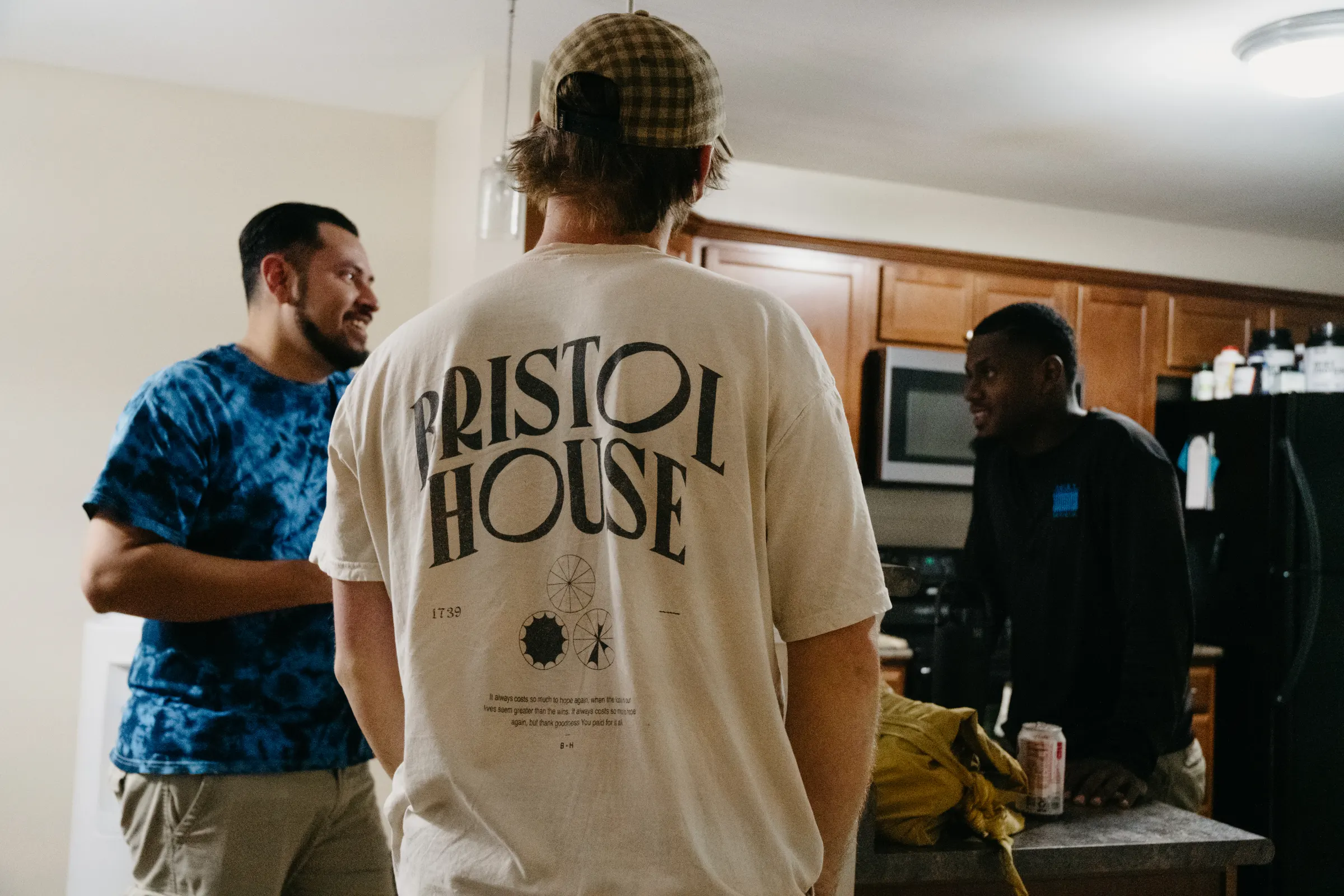 The lead team laughing in the kitchen